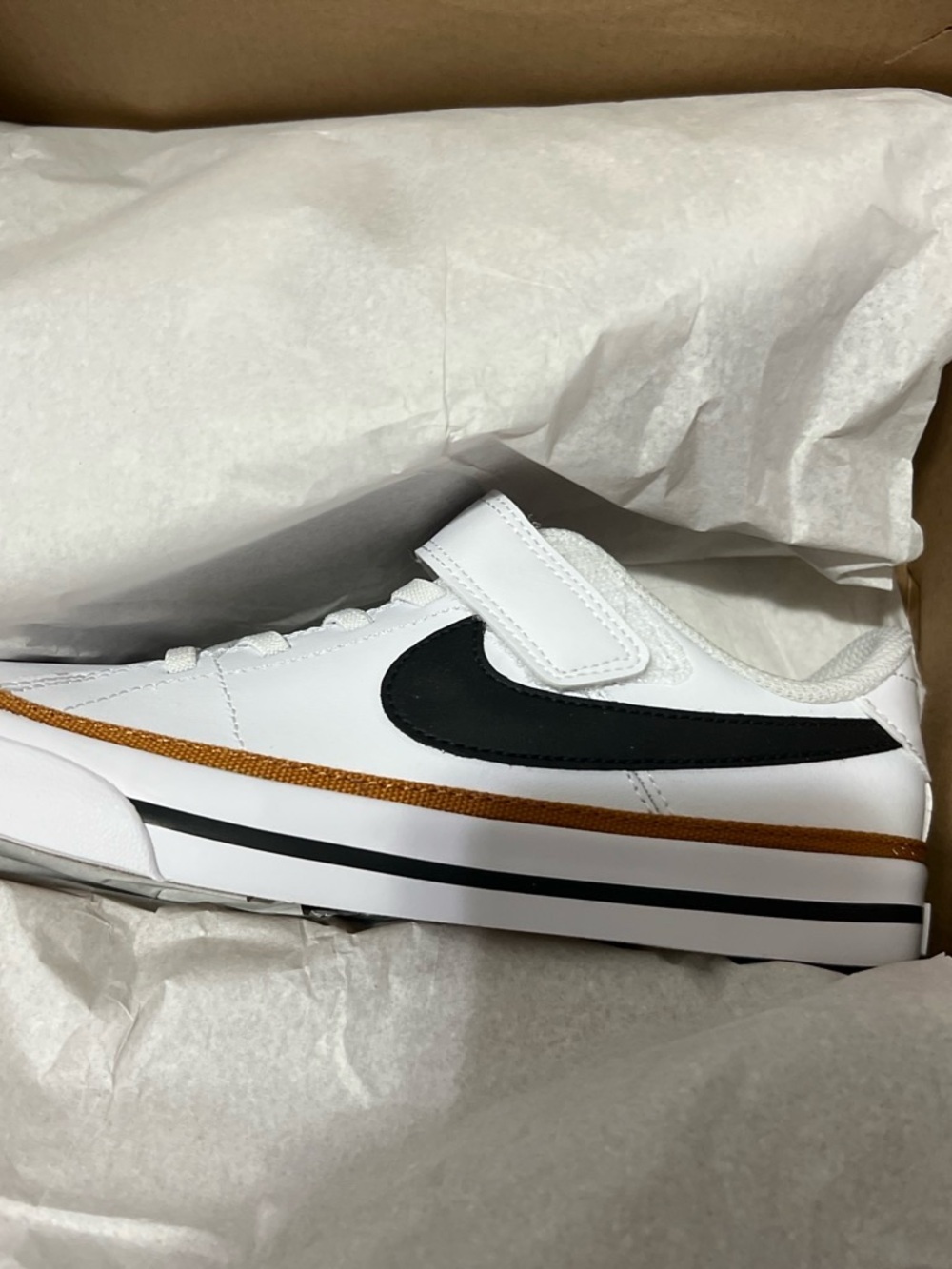 Nike Kids White Sneakers with Black Swoosh and Copper Accent - Velcro